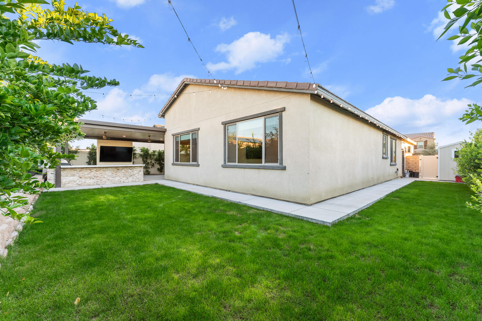 84458 Calle Larriva Coachella, CA 92236 - Photo 35 of 43 a view of a backyard with plants and a garden