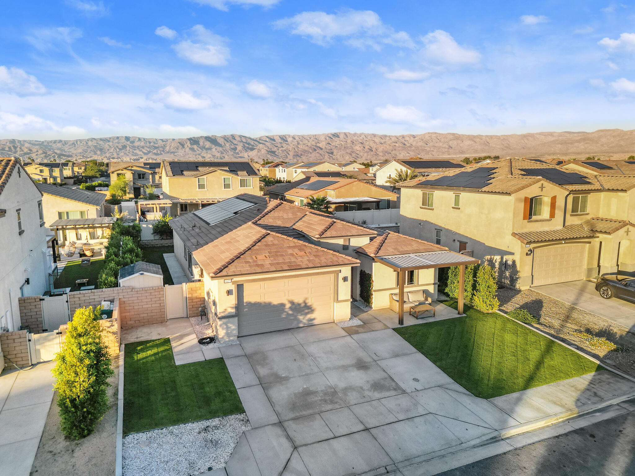 84458 Calle Larriva Coachella, CA 92236 - Photo 4 of 43 an aerial view of residential houses with outdoor space and swimming pool
