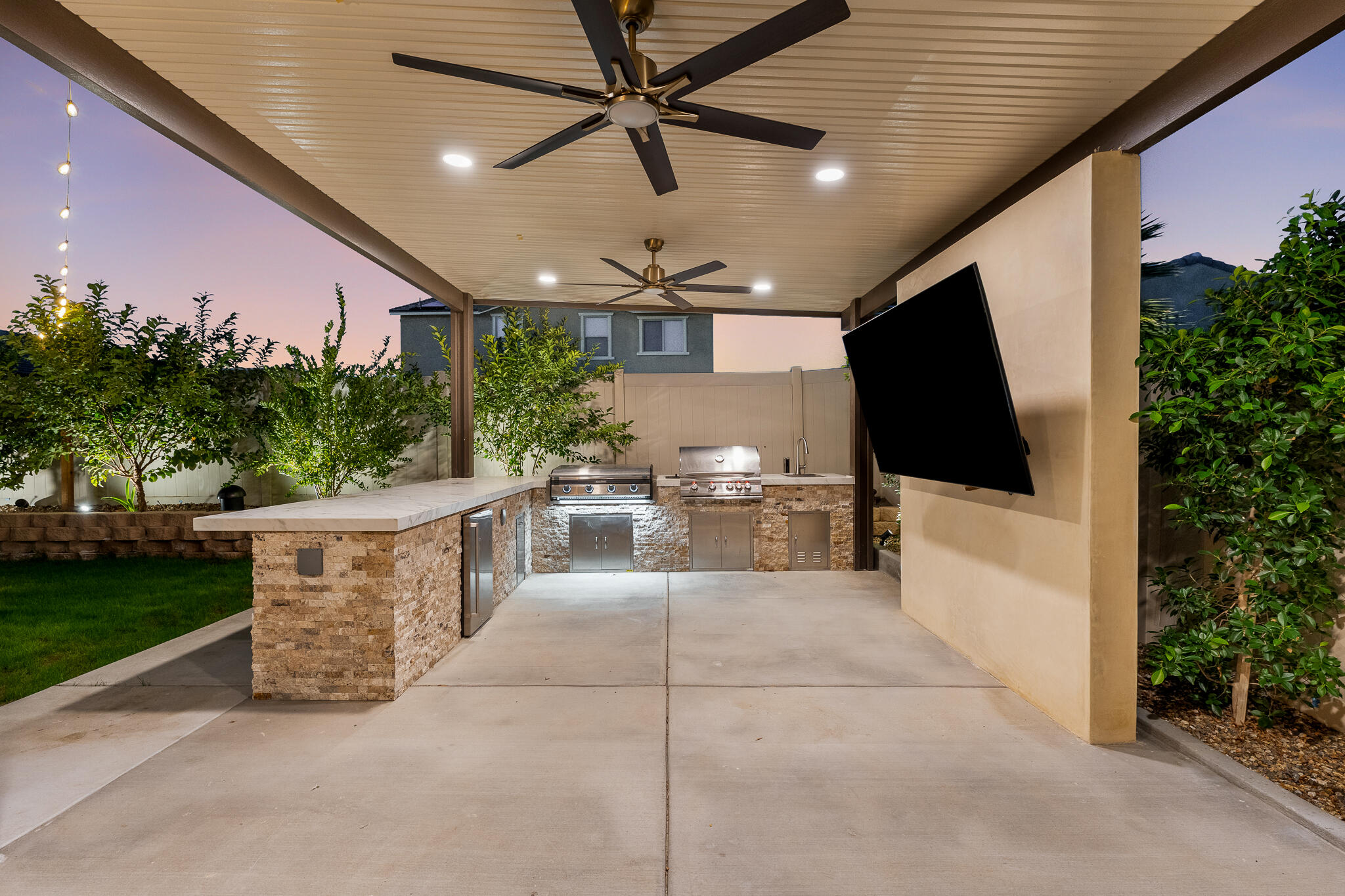 84458 Calle Larriva Coachella, CA 92236 - Photo 42 of 43 a view of a patio with a table and chairs and potted plants
