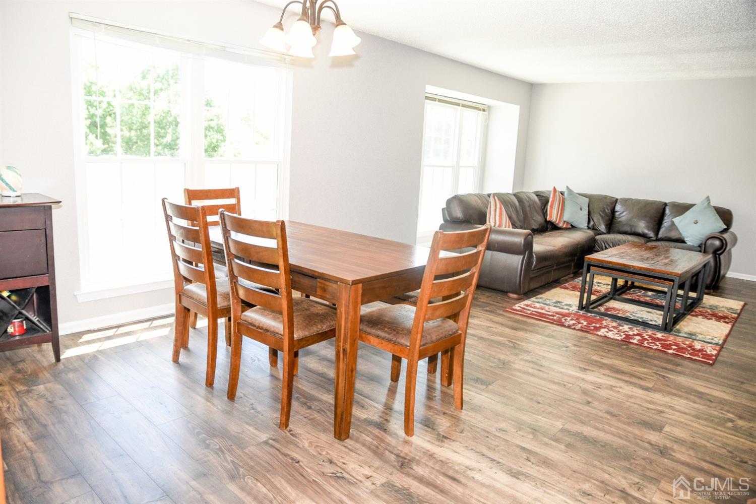 4206 Riddle Court Bridgewater, NJ 08807 - Photo 12 of 25 a living room with furniture a wooden floor and next to a window
