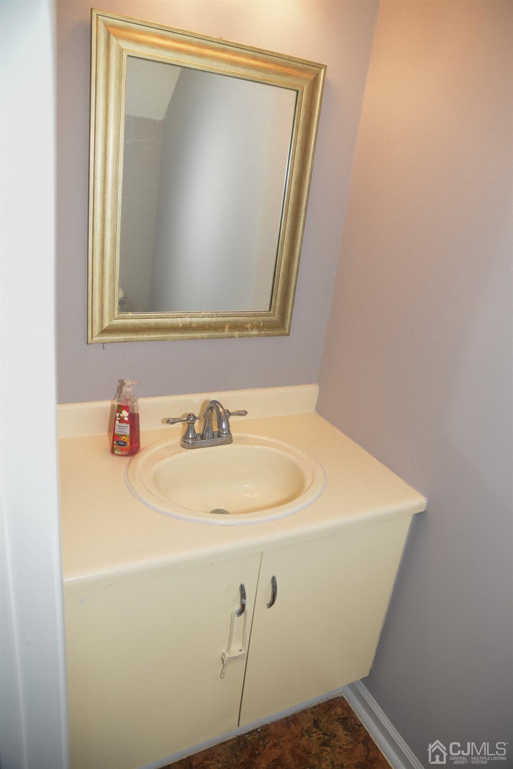 4206 Riddle Court Bridgewater, NJ 08807 - Photo 13 of 25 a close up of a sink and a mirror