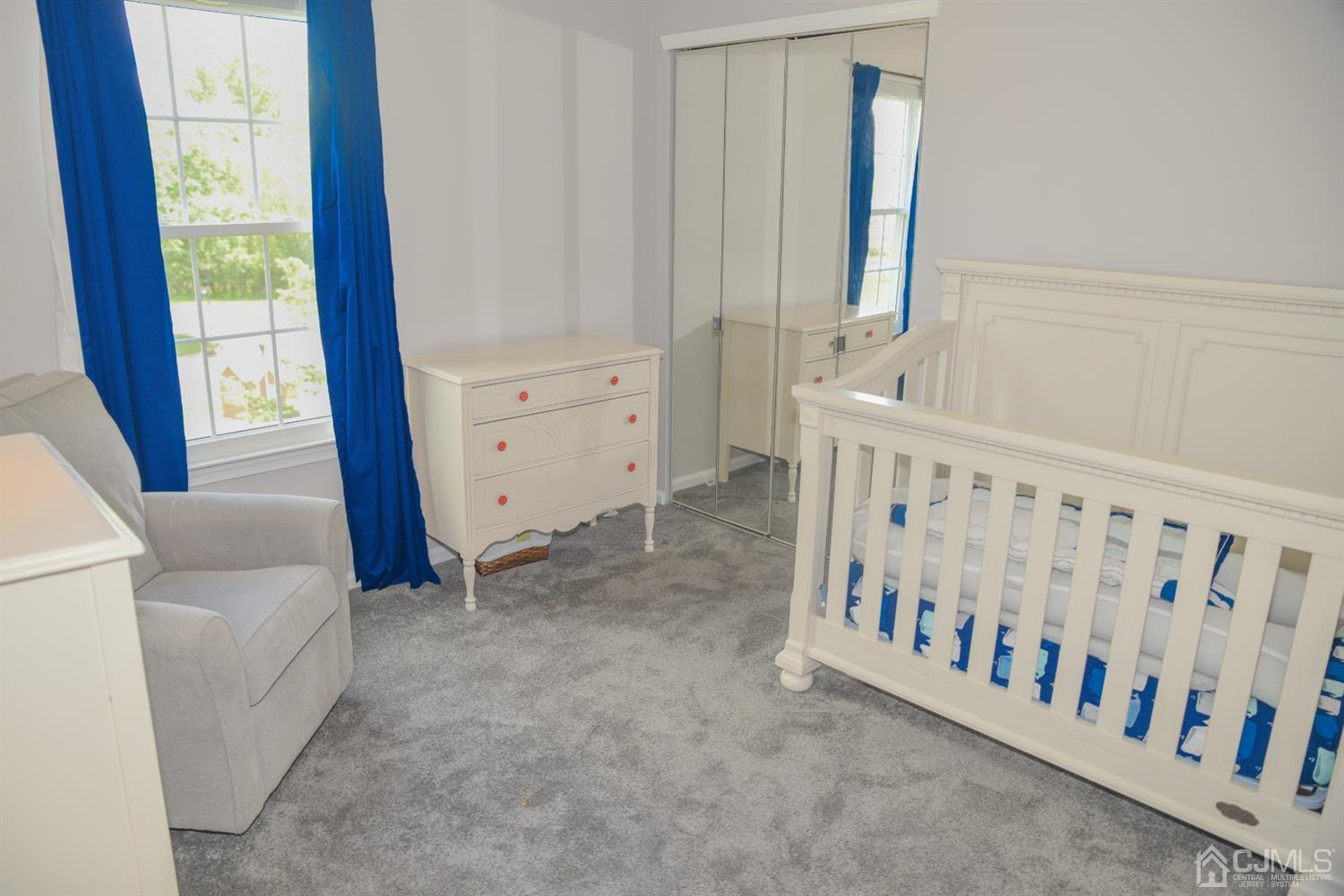 4206 Riddle Court Bridgewater, NJ 08807 - Photo 15 of 25 a view of a bedroom with wooden floor and windows