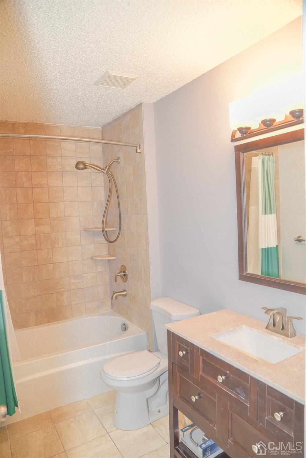 4206 Riddle Court Bridgewater, NJ 08807 - Photo 16 of 25 a bathroom with a granite countertop bathtub shower sink vanity and toilet