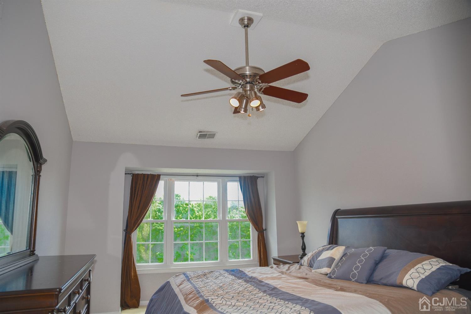 4206 Riddle Court Bridgewater, NJ 08807 - Photo 19 of 25 a bedroom with a large bed and a window