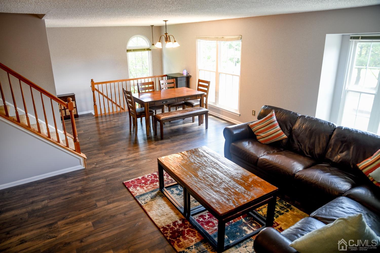 4206 Riddle Court Bridgewater, NJ 08807 - Photo 8 of 25 a living room with furniture and a wooden floor