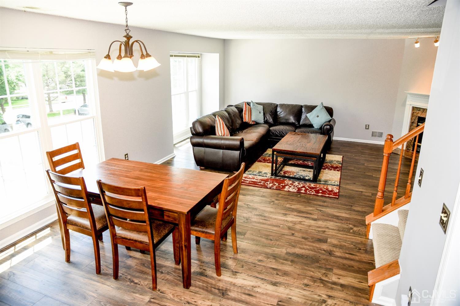 4206 Riddle Court Bridgewater, NJ 08807 - Photo 10 of 25 a dining room with furniture and wooden floor