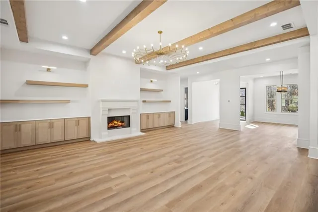 a kitchen with stainless steel appliances a stove a sink and a refrigerator