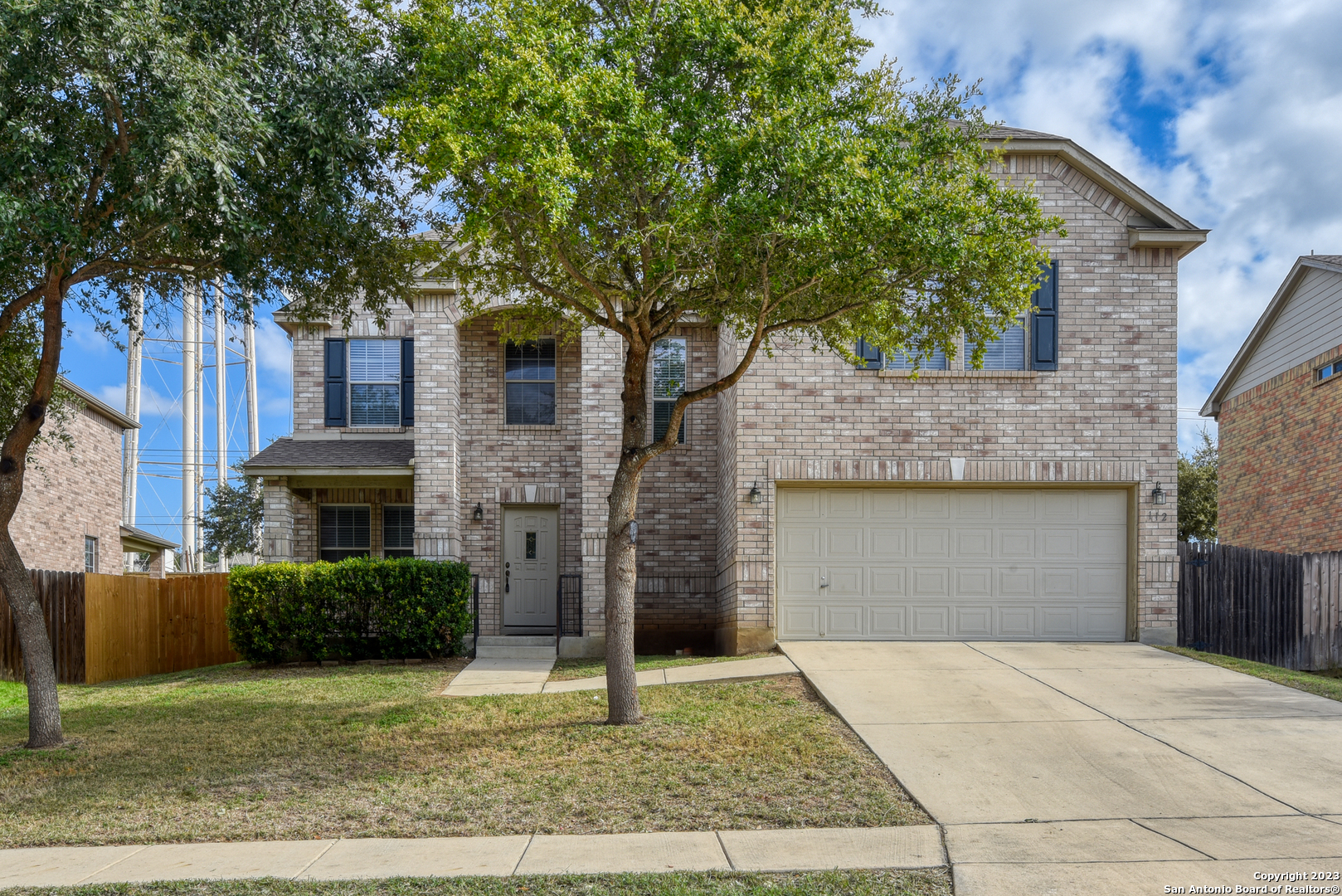 112 Springtree Run Cibolo, TX 78108 - Photo 1 of 1 a front view of a house with a yard and garage