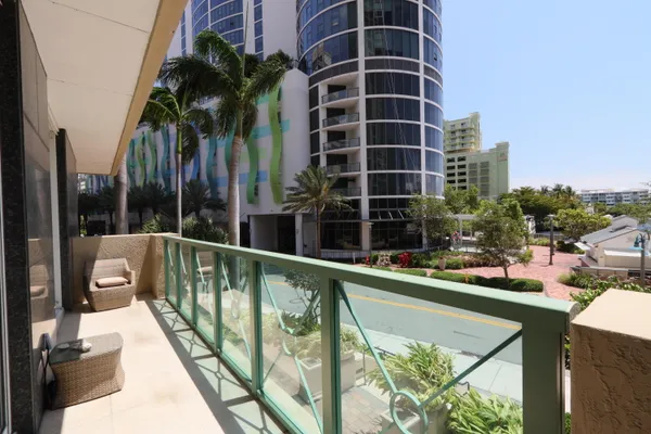 a view of swimming pool from a balcony