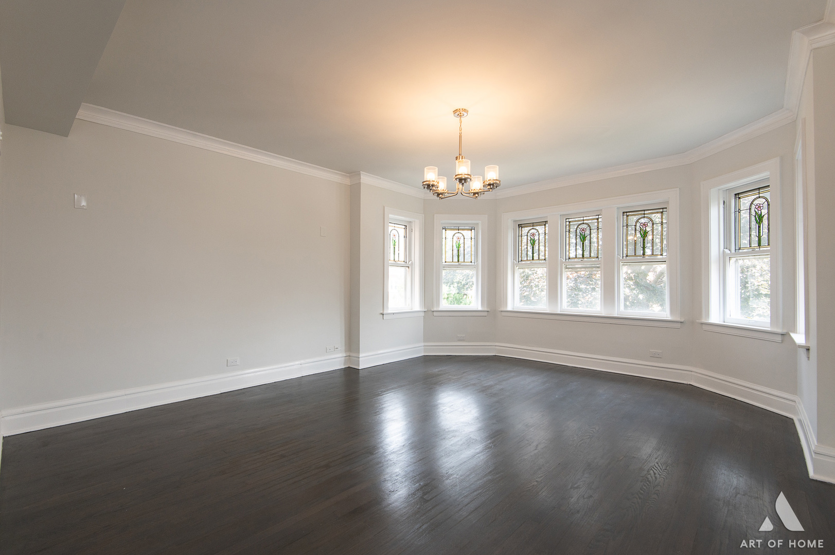 1820 Gunderson Avenue, Unit 3 Berwyn, IL 60402 - Photo 2 of 17 a view of an empty room with wooden floor and a window
