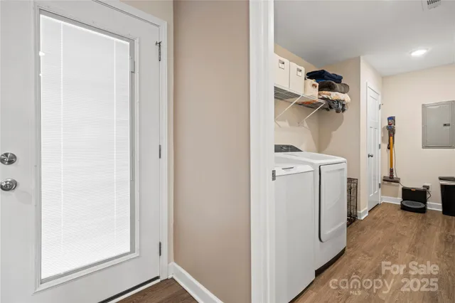 a view of a storage & utility room with a washer dryer