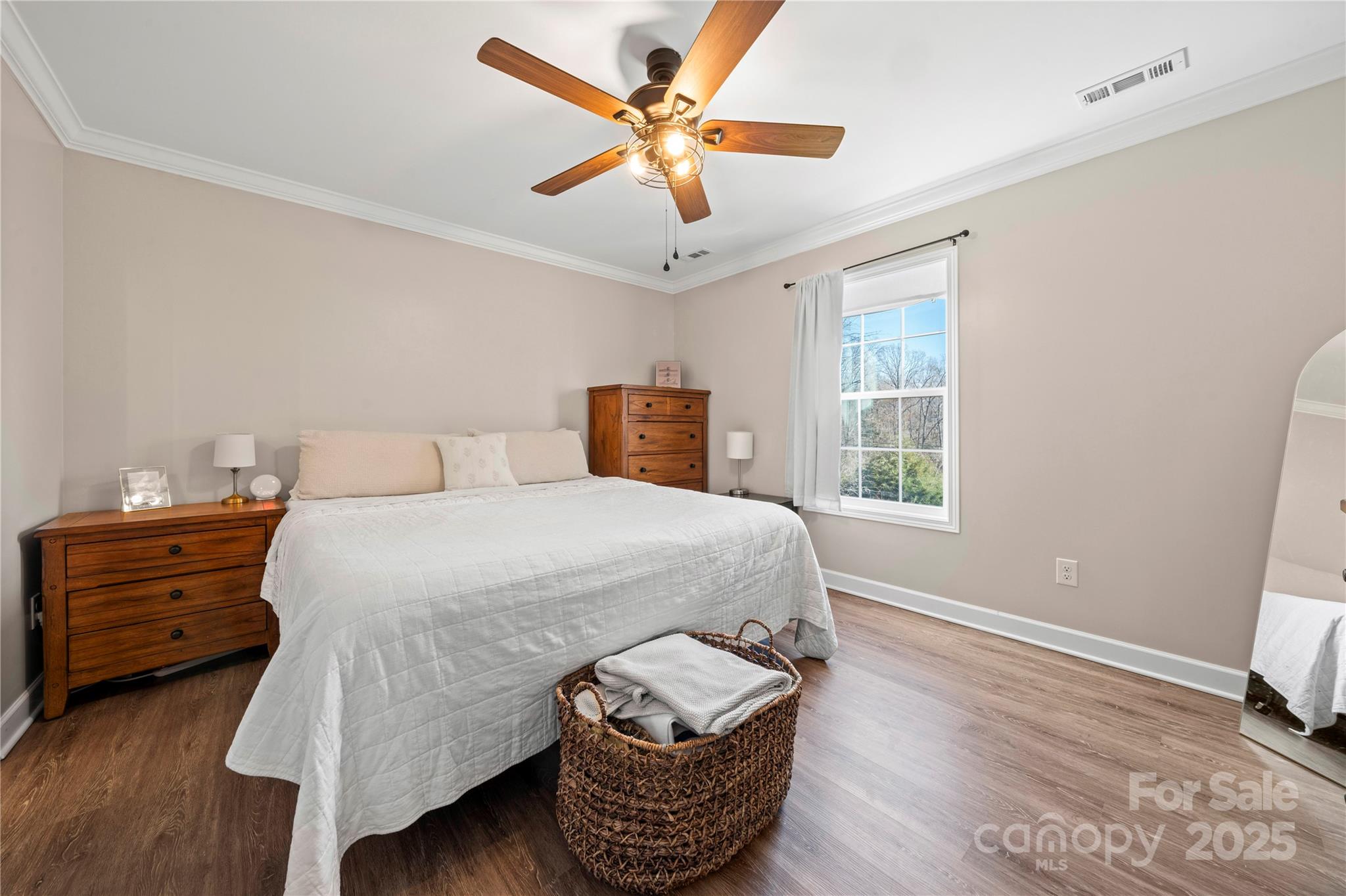 131 Lowry Row, Unit 8 York, SC 29745 - Photo 18 of 32 a bedroom with a bed and wooden floor
