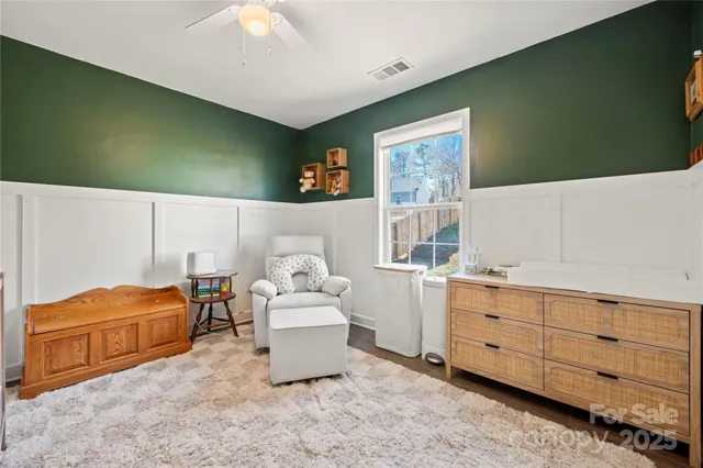 a bed room with furniture and a window