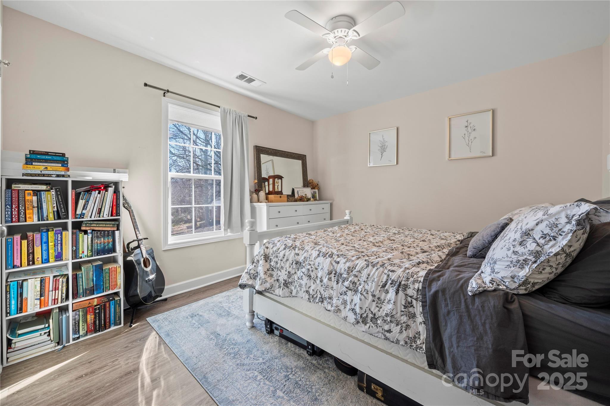 131 Lowry Row, Unit 8 York, SC 29745 - Photo 24 of 32 a bedroom with a bed furniture and a book shelf