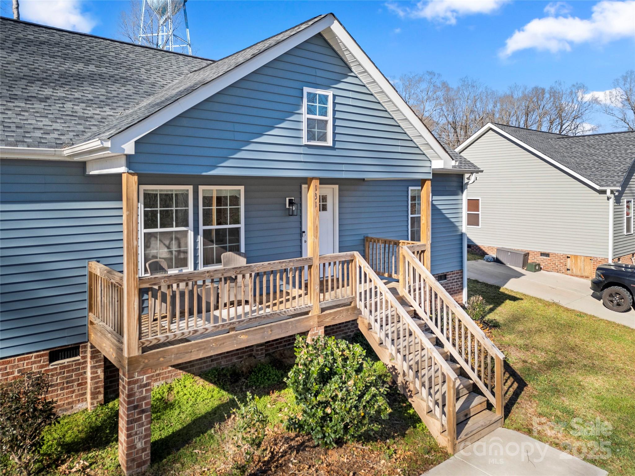 131 Lowry Row, Unit 8 York, SC 29745 - Photo 26 of 32 a view of a wooden deck with a bench