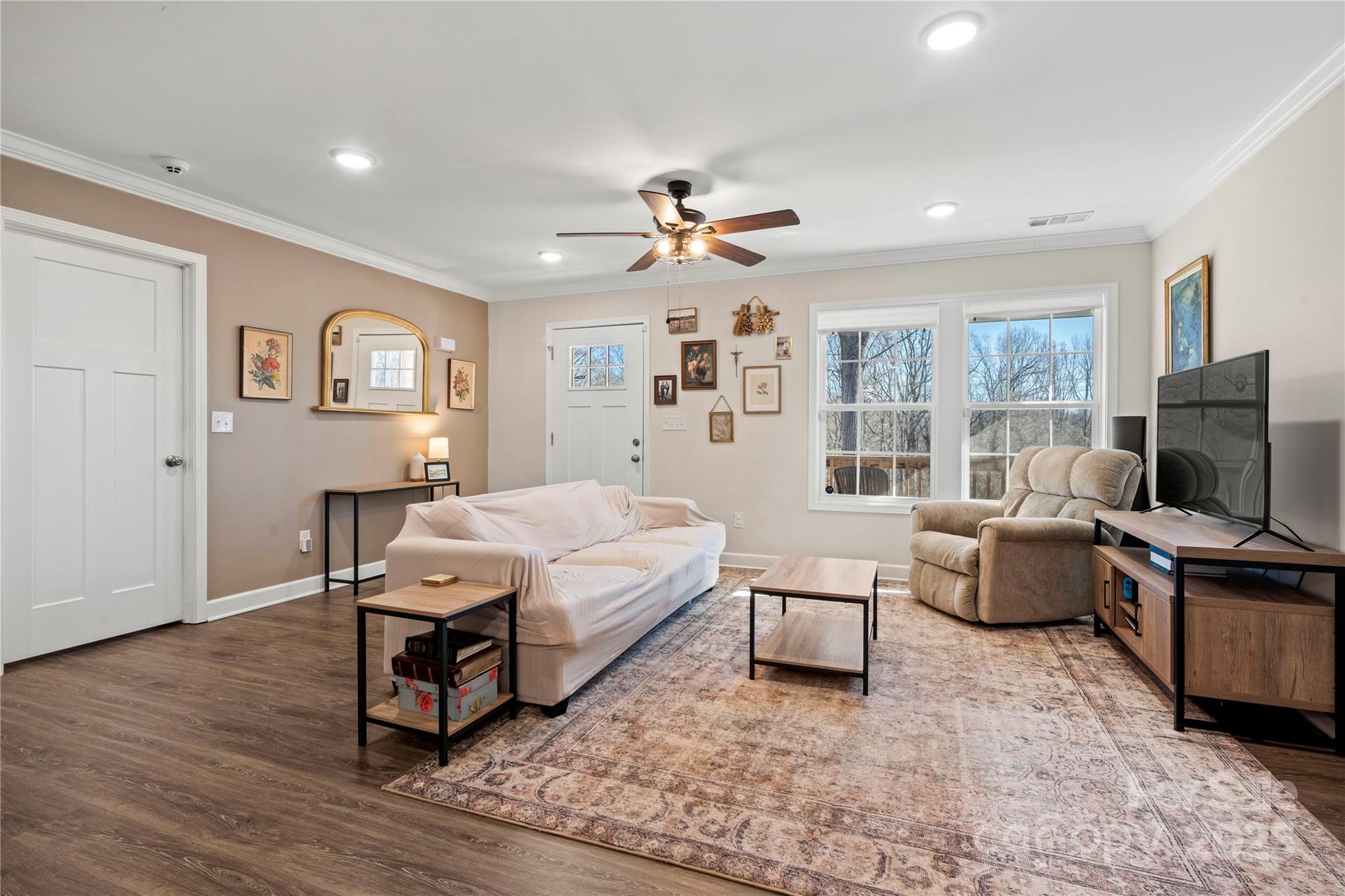 131 Lowry Row, Unit 8 York, SC 29745 - Photo 6 of 32 a spacious bedroom with a bed and a flat screen tv
