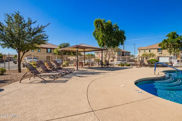 a view of a patio with swimming pool