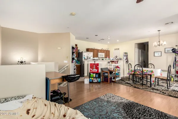 a bedroom with furniture and a wooden floor