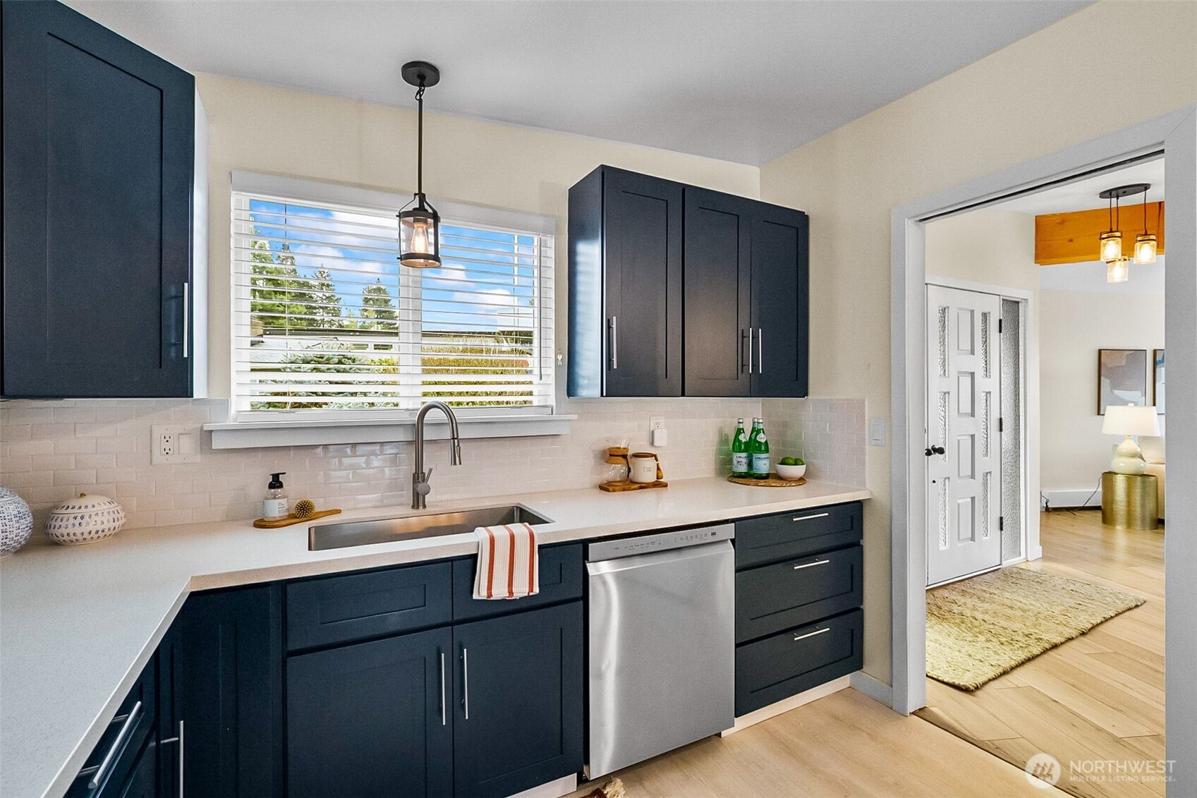 18215 3rd Place Southwest Normandy Park, WA 98166 - Photo 13 of 35 a kitchen with a sink cabinets and window