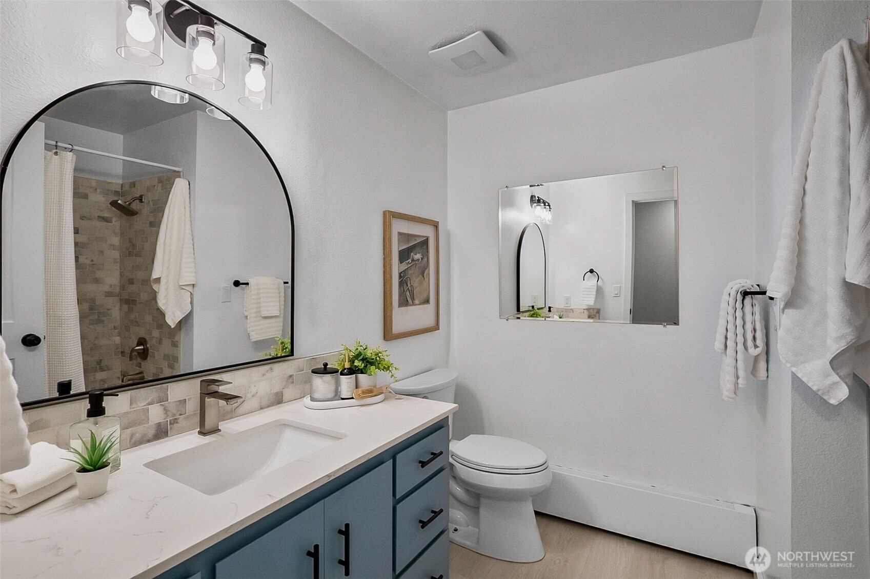 18215 3rd Place Southwest Normandy Park, WA 98166 - Photo 15 of 35 a bathroom with a toilet sink and mirror