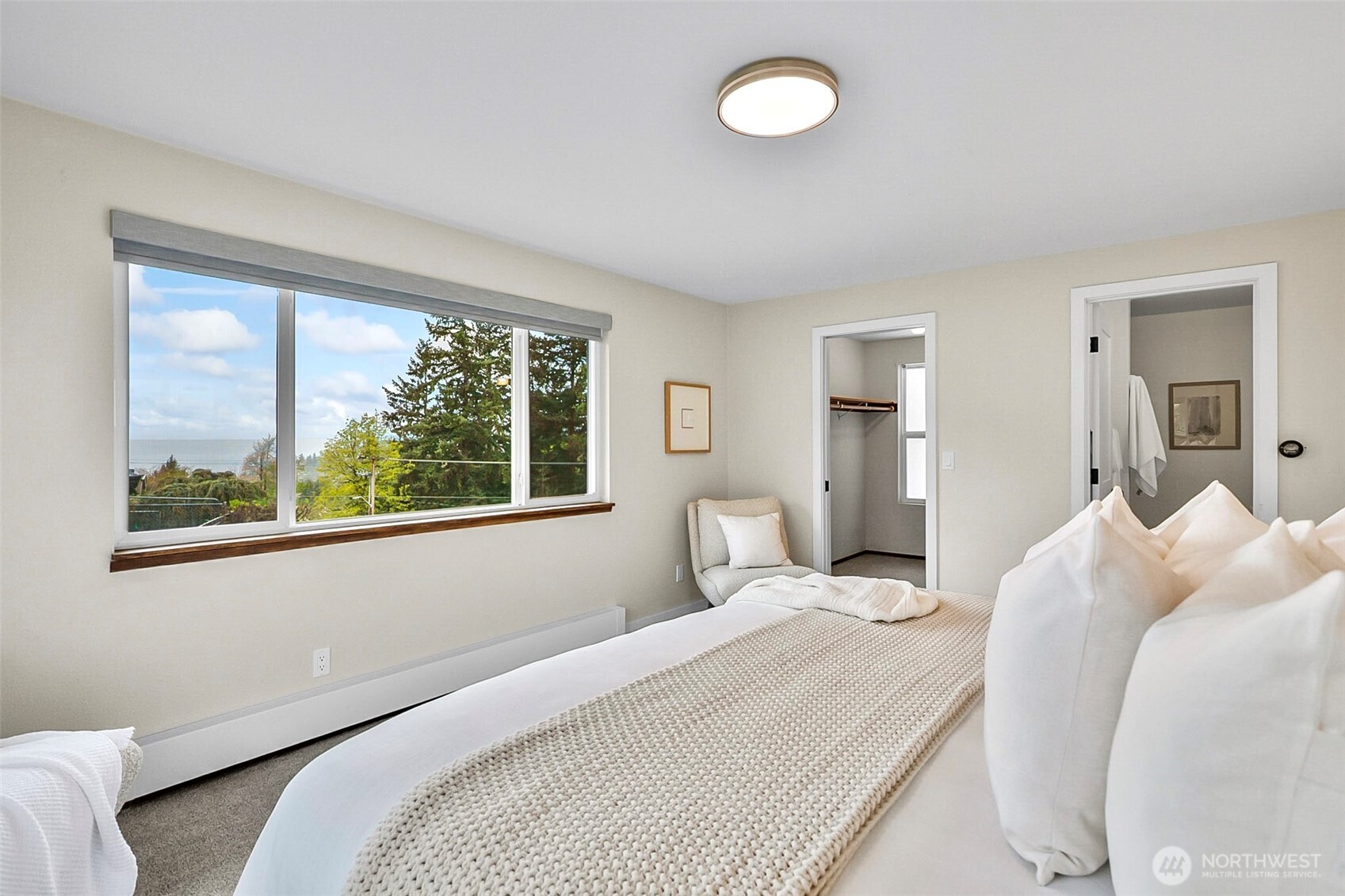 18215 3rd Place Southwest Normandy Park, WA 98166 - Photo 16 of 35 a bedroom with a bed and a large window