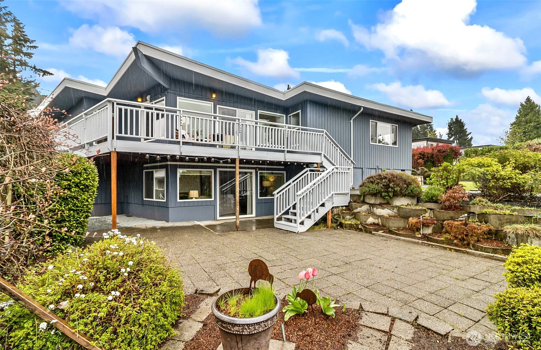 18215 3rd Place Southwest Normandy Park, WA 98166 - Photo 26 of 35 a front view of a house with a yard and potted plants