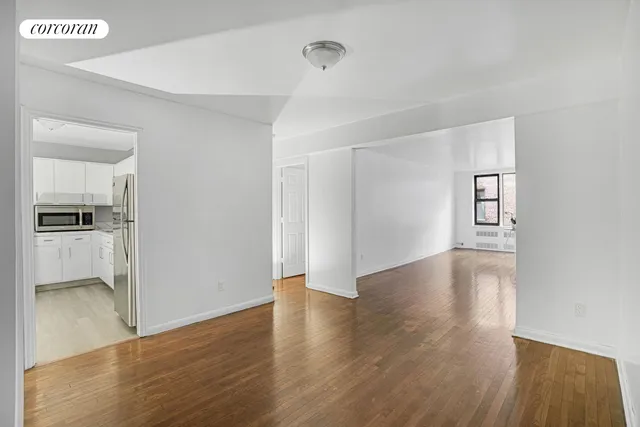 a view of livingroom with hardwood floor and a sink