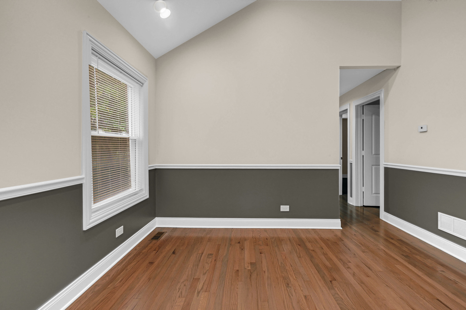 703 West 129th Place Chicago, IL 60628 - Photo 12 of 29 a view of room with window and wooden floor