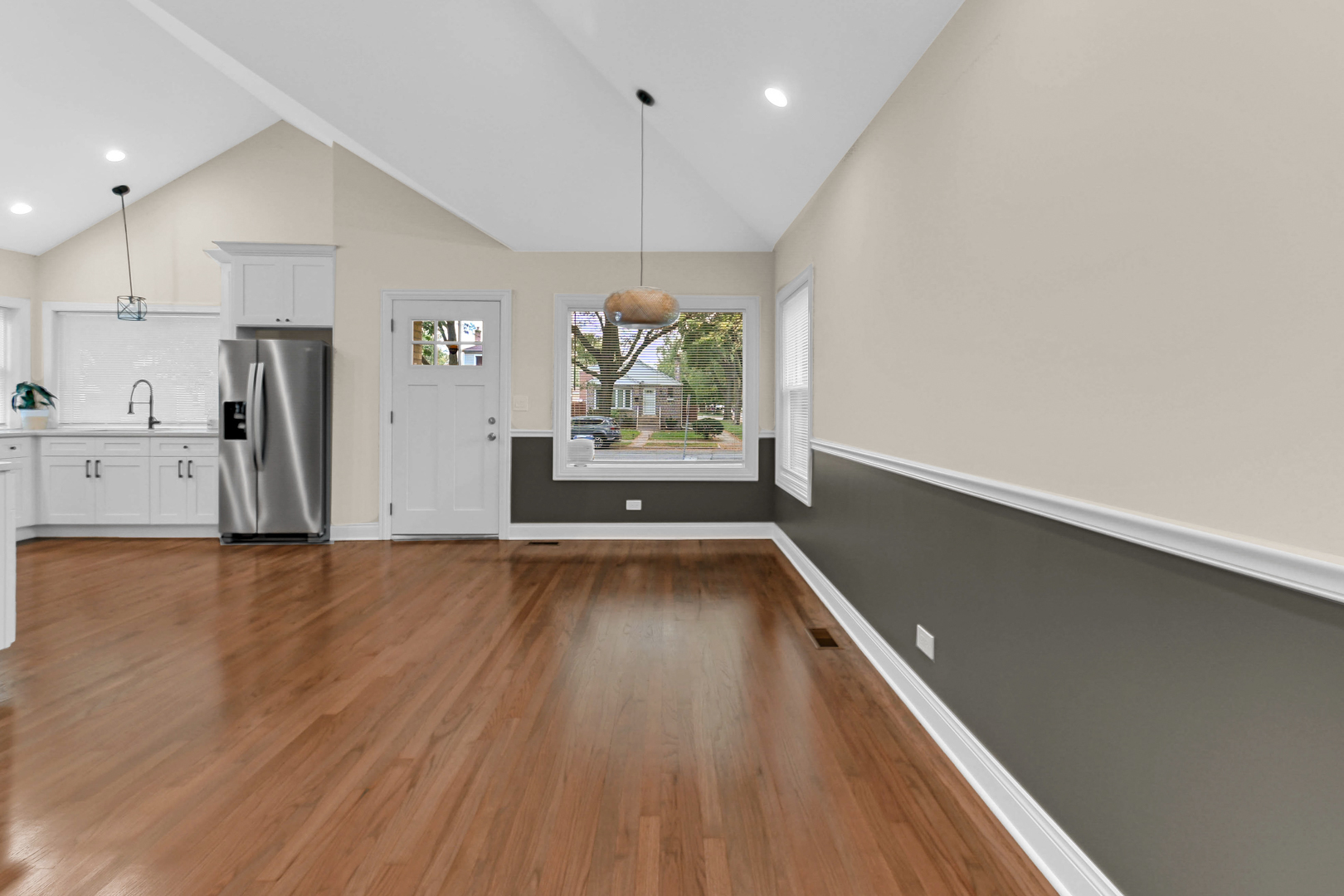 703 West 129th Place Chicago, IL 60628 - Photo 13 of 29 a view of kitchen with cabinets and wooden floor