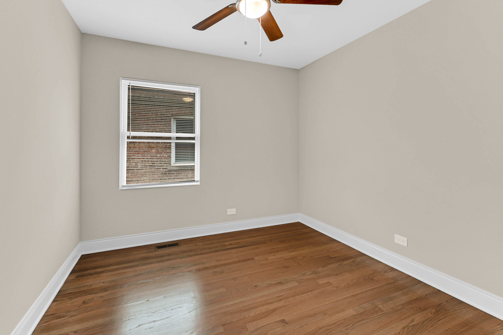 703 West 129th Place Chicago, IL 60628 - Photo 22 of 29 an empty room with a window