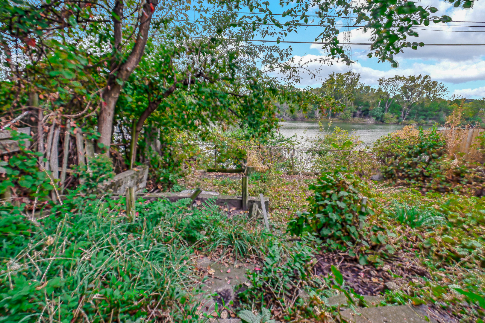 703 West 129th Place Chicago, IL 60628 - Photo 9 of 29 a view of a lake with a house in background