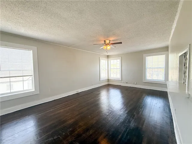 an empty room with wooden floor