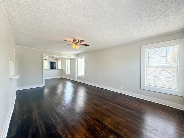 a view of a balcony with wooden floor and furniture