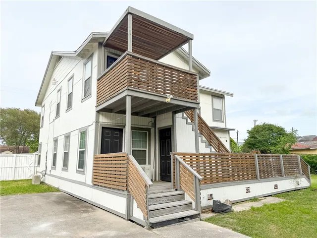 a view of a house with a roof deck