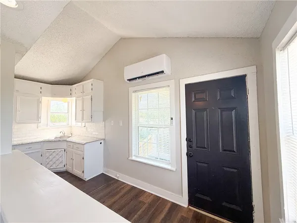 wooden floor in an empty room and a window