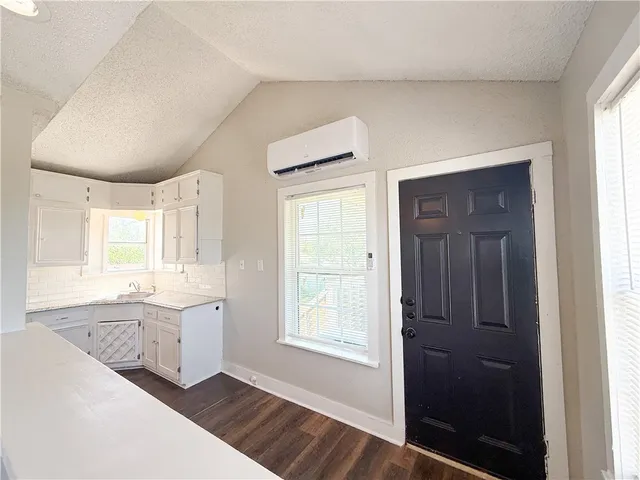 wooden floor in an empty room and a window