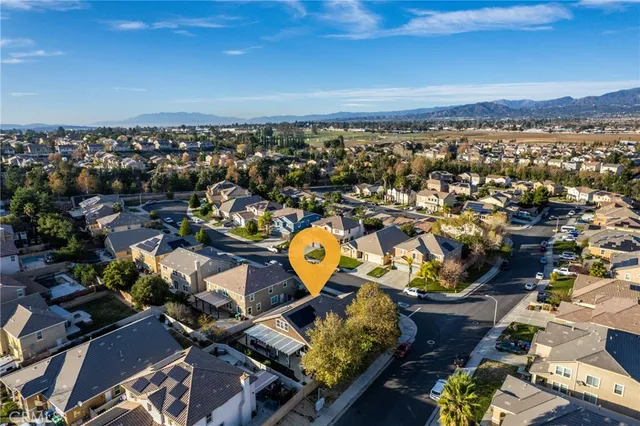 an aerial view of a house with a swimming pool
