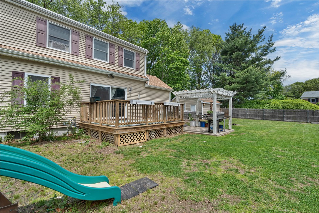 190 Sand Pond Road Warwick, RI 02888 - Photo 7 of 13 Private, fenced yard with deck & patio