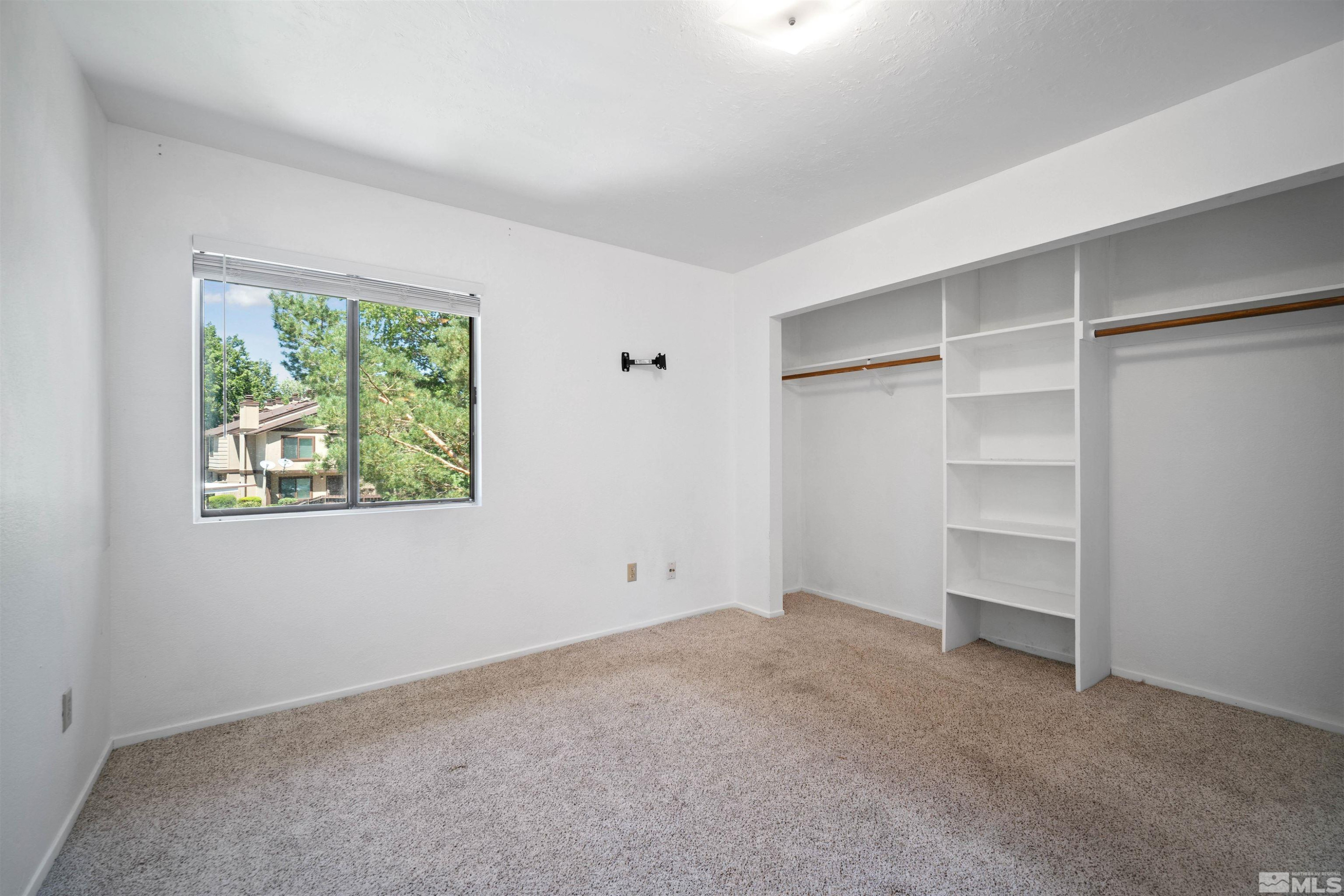 4769 Reggie Road, Unit 254 Reno, NV 89502 - Photo 12 of 23 a view of an empty room with a window