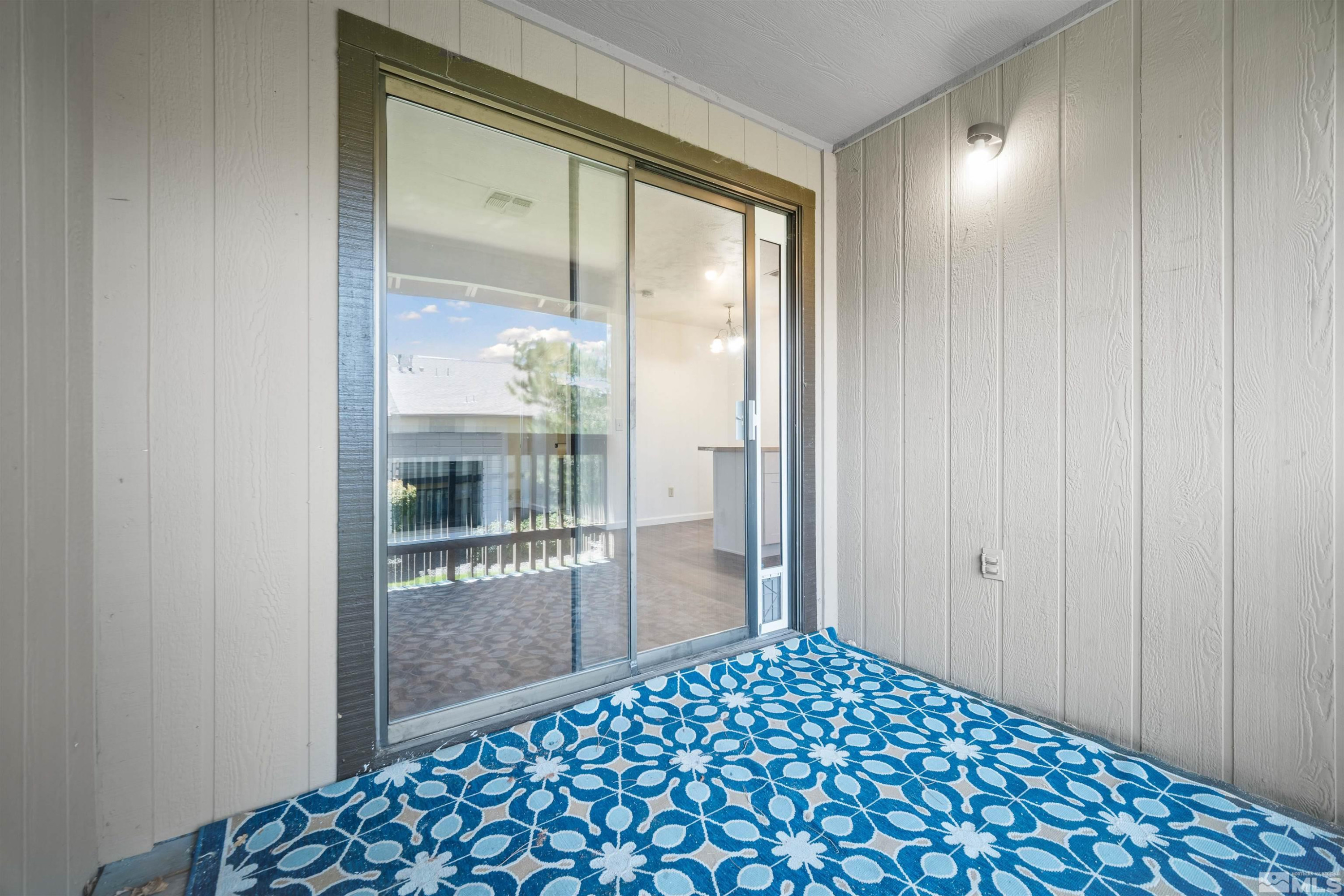 4769 Reggie Road, Unit 254 Reno, NV 89502 - Photo 15 of 23 a bedroom view with a glass door and shower