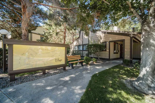 a backyard of a house with shaded area