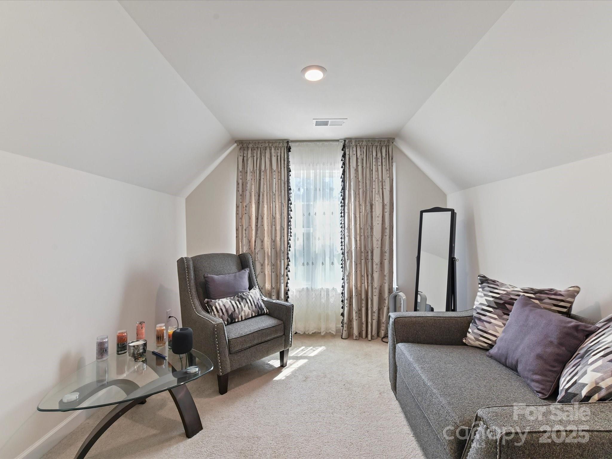 9890 Travertine Trail Davidson, NC 28036 - Photo 17 of 45 a living room with furniture and a large window