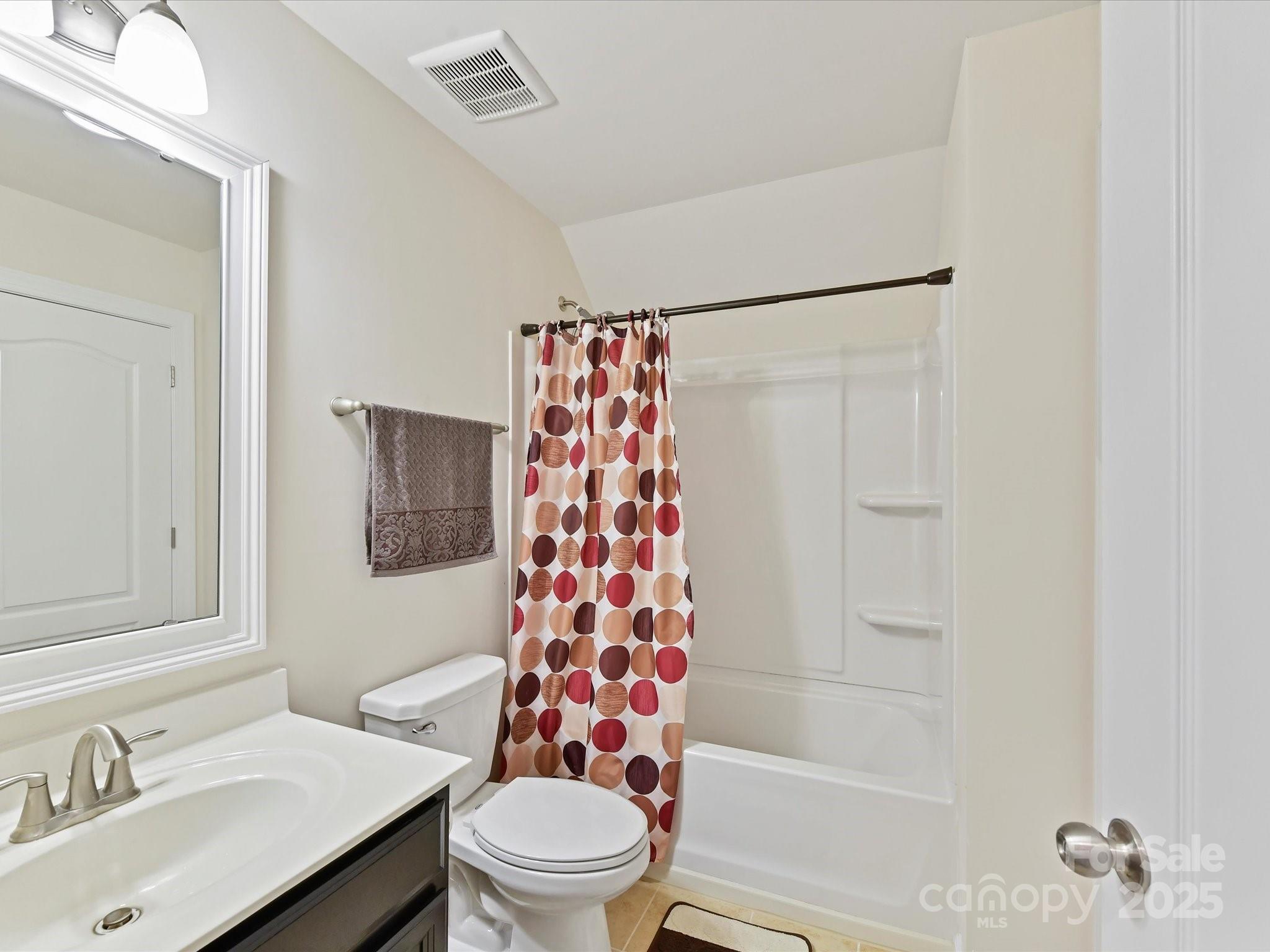 9890 Travertine Trail Davidson, NC 28036 - Photo 27 of 45 a bathroom with a sink toilet and shower