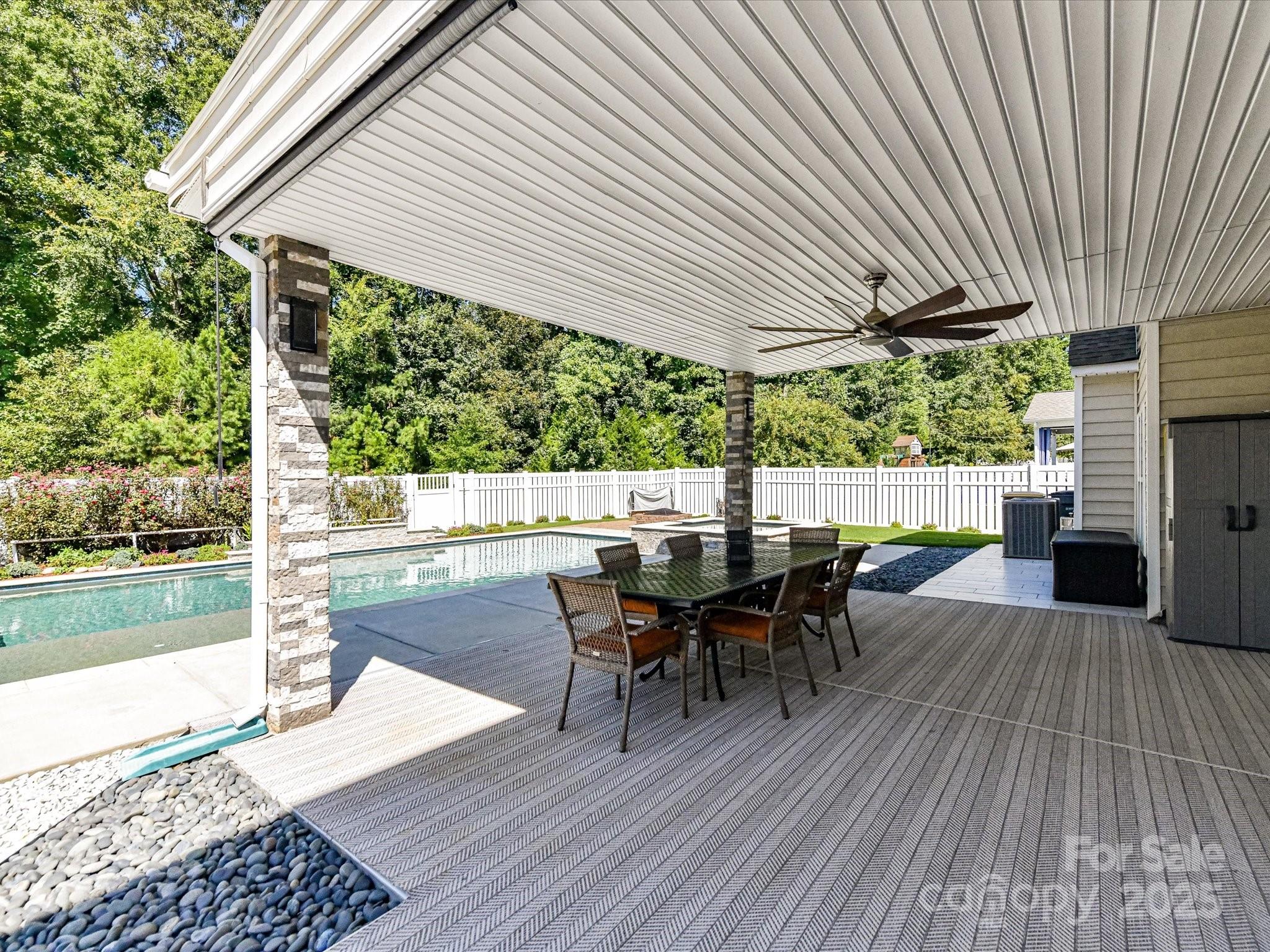 9890 Travertine Trail Davidson, NC 28036 - Photo 33 of 45 a outdoor view with a sitting space and large trees