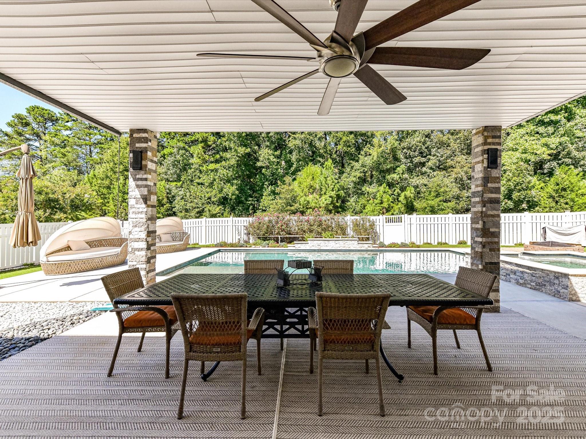 9890 Travertine Trail Davidson, NC 28036 - Photo 35 of 45 a view of a dining room with furniture window and wooden floor