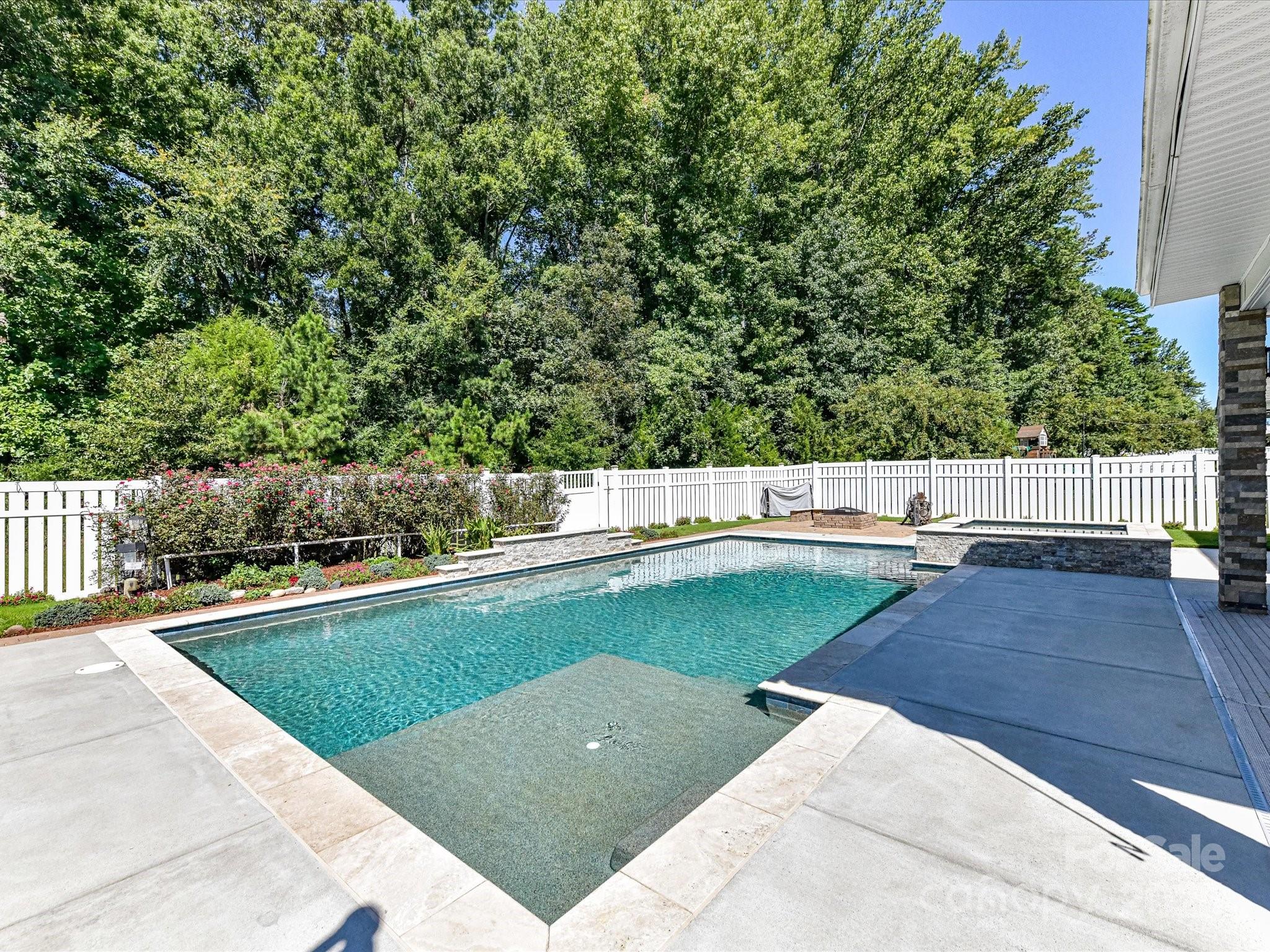 9890 Travertine Trail Davidson, NC 28036 - Photo 38 of 45 a view of swimming pool with a yard
