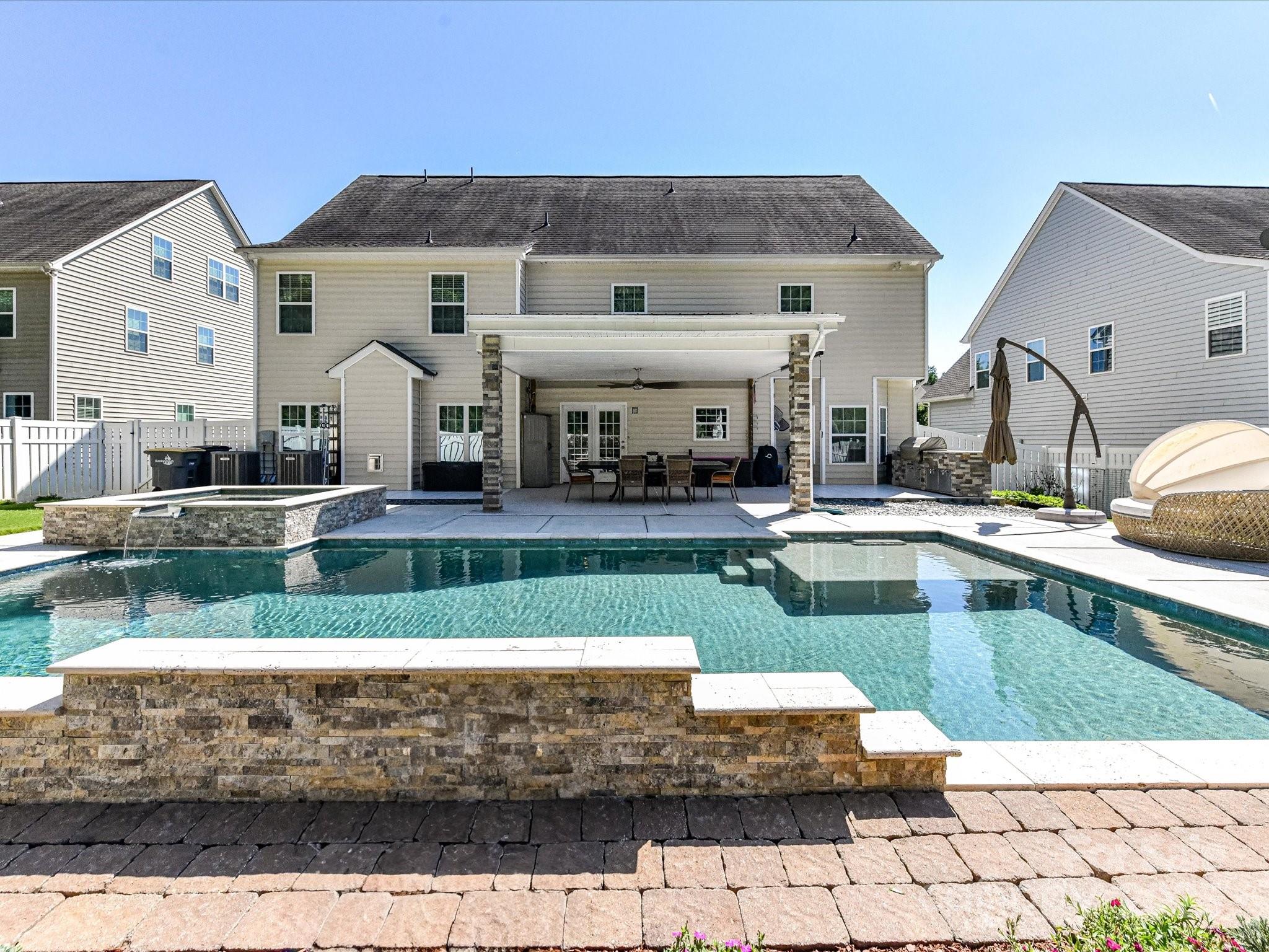 9890 Travertine Trail Davidson, NC 28036 - Photo 42 of 45 a view of a house with a swimming pool
