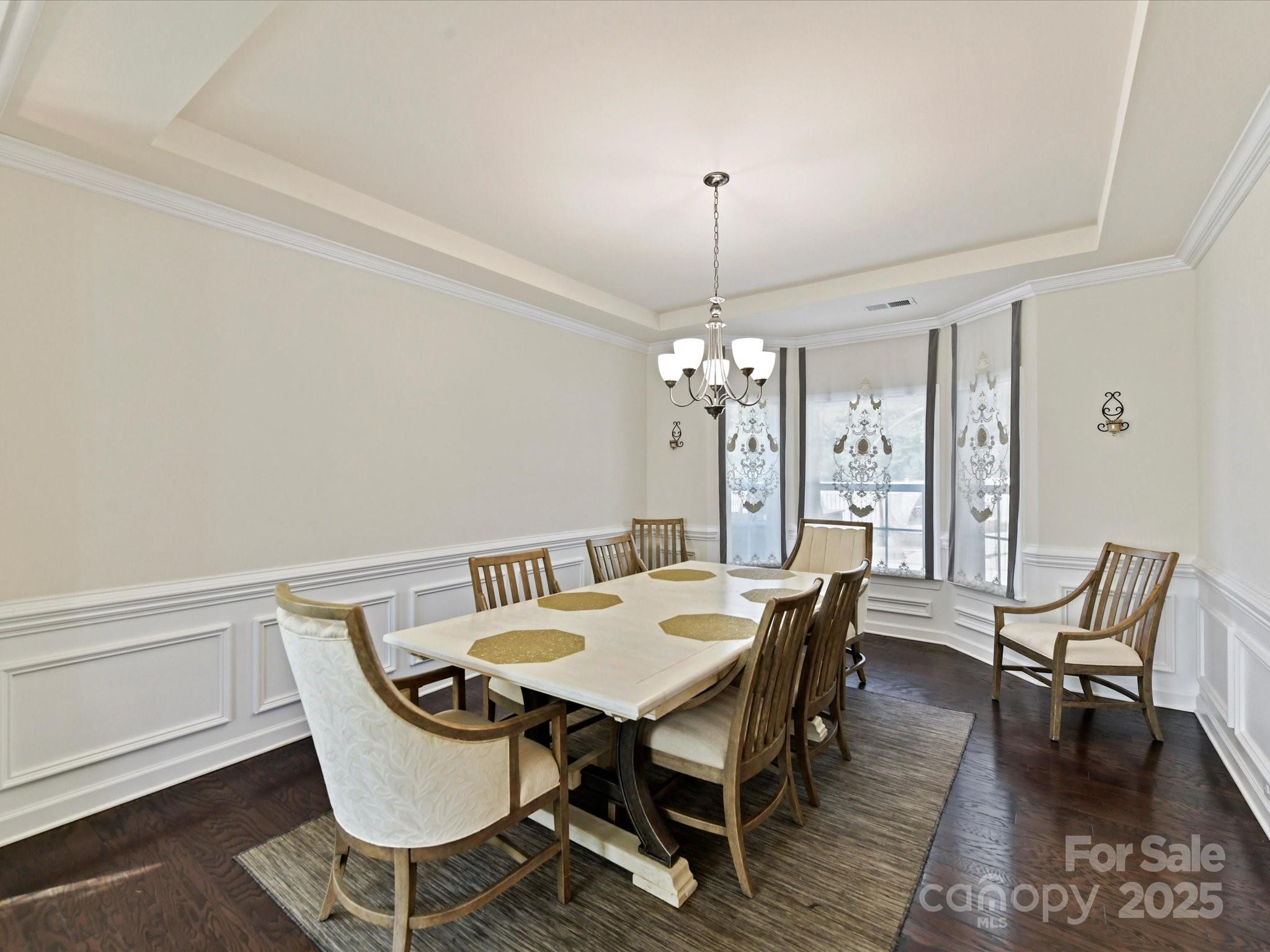 9890 Travertine Trail Davidson, NC 28036 - Photo 7 of 45 a view of a dining room with furniture window and wooden floor