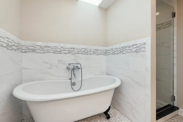 a white bath tub sitting in a bathroom