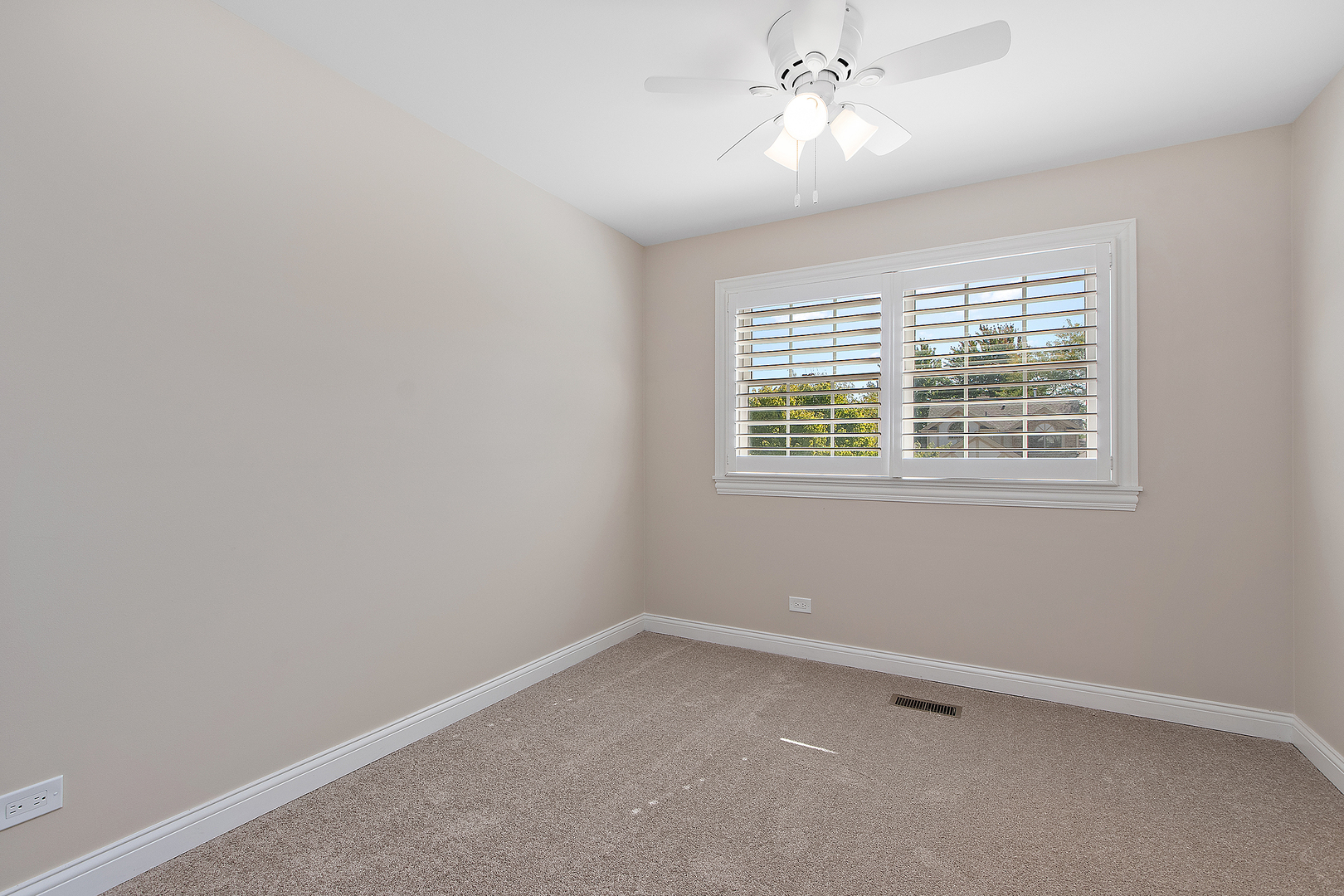 10534 Golf Road Orland Park, IL 60462 - Photo 17 of 54 an empty room with a window and a fan